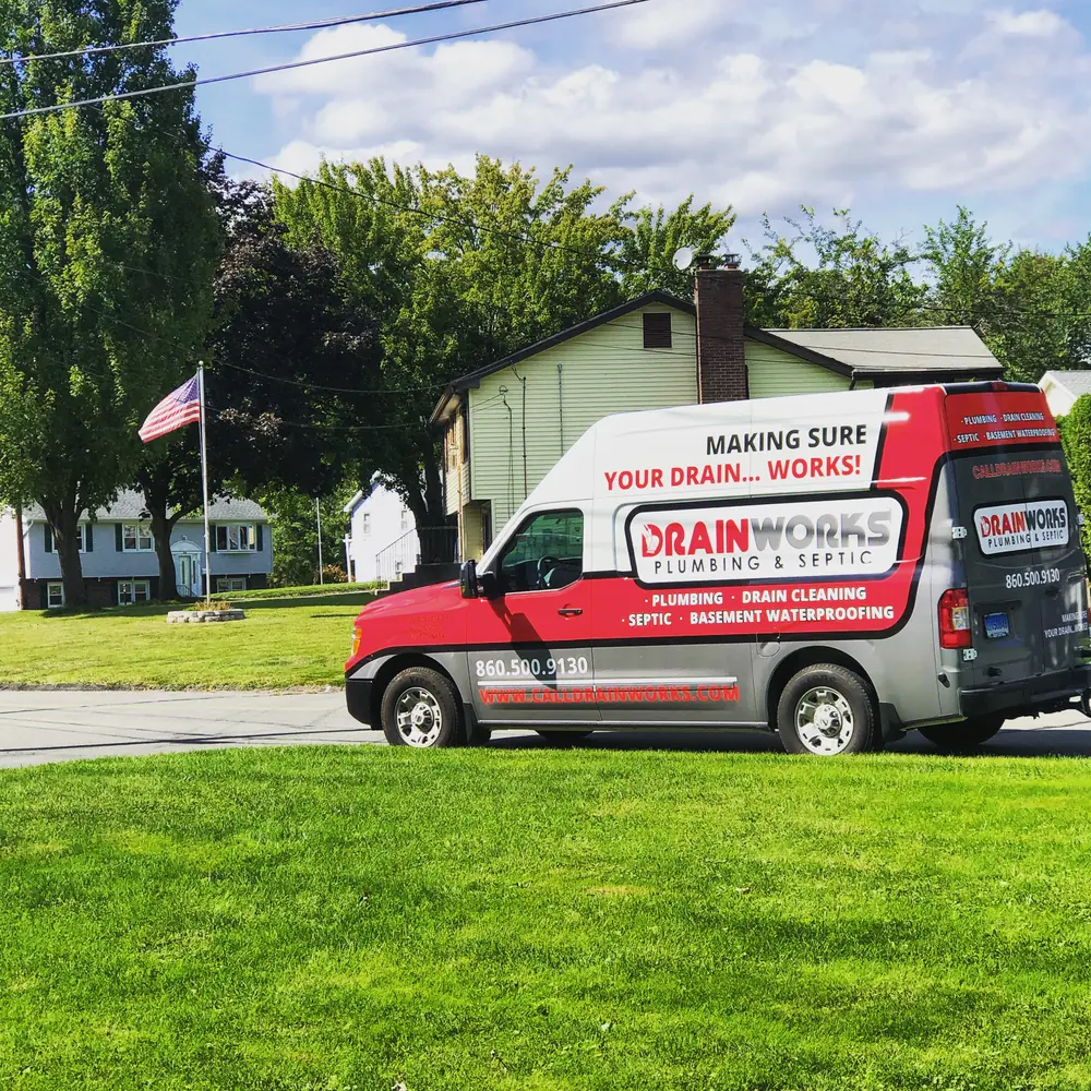 Drainworks service van parked outside a home in western Connecticut